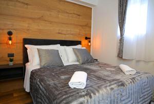 Postel nebo postele na pokoji v ubytování Apartmani Krka Rooms