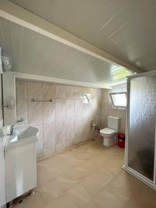 a bathroom with a sink and a toilet at Somos Flats - Mavişehir in Didim