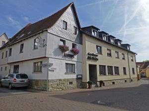 a building with a car parked in front of it at Hotel Alte Brücke in Bad Homburg vor der Höhe