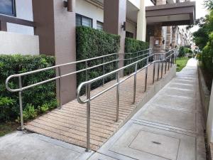 a metal hand rail next to a building at Condo for rent in Davao City in Davao City