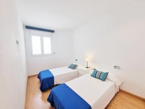 Posteľ alebo postele v izbe v ubytovaní Apartamento Penelope