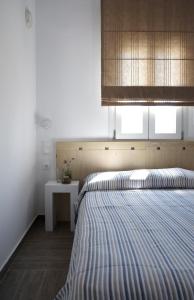 Ένα ή περισσότερα κρεβάτια σε δωμάτιο στο Studio Ornos