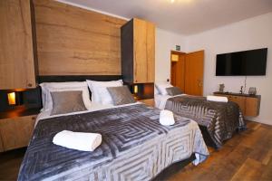 Postel nebo postele na pokoji v ubytování Apartmani Krka Rooms