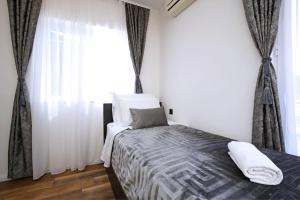 Postel nebo postele na pokoji v ubytování Apartmani Krka Rooms
