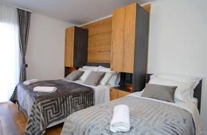 Postel nebo postele na pokoji v ubytování Apartmani Krka Rooms