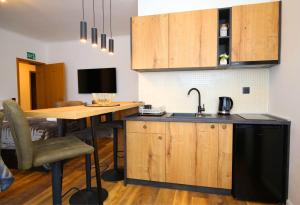 Kuchyň nebo kuchyňský kout v ubytování Apartmani Krka Rooms