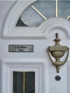 a door of a boat with a sign on it at Villa Laguna -house by the beach in Karavómilos