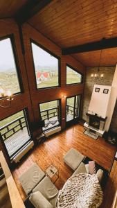 an overhead view of a living room with large windows at Sirnea Chalet in Şirnea