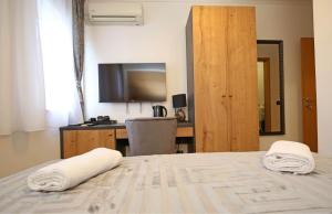Postel nebo postele na pokoji v ubytování Apartmani Krka Rooms