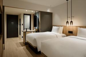 Postel nebo postele na pokoji v ubytování Fairfield by Marriott Mie Kumano Kodo Mihama + 16 fotografií