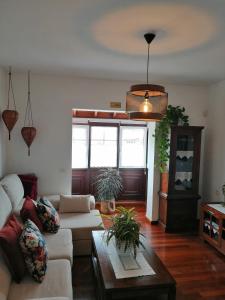 a living room with a couch and a table at Villa La Victoria in Tegueste