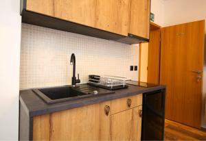 Kuchyň nebo kuchyňský kout v ubytování Apartmani Krka Rooms