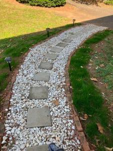 a walkway with rocks and grass in a park at Home-Made-In-Hickory-Large Home with a Pool! Fun! in Hickory