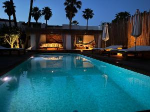 una piscina en un complejo por la noche en VILLA SERENITY 3 Luxury boutique villa en Sant Jordi
