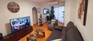 Televízia a/alebo spoločenská miestnosť v ubytovaní Europlaya Calpe