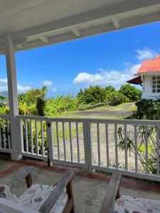 a view from the porch of a house at Habitation La Reine du Camp Chambres d'Hôtes in Saint-Claude