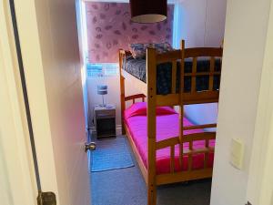 Łóżko lub łóżka piętrowe w pokoju w obiekcie ARRIENDO EXCLUSIVO DPTO en LA SERENA