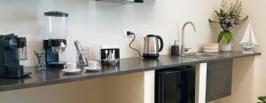 a kitchen counter with various appliances on it at 42 Zanardelli B&B in Trani