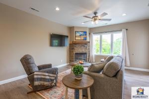 a living room with a couch and a fireplace at New Build - Walk-In 3BR Condo with Arcade Game - FREE ATTRACTION TICKETS INCLUDED -- FHG-207 in Branson