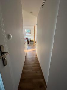 a hallway leading to a room with a door at Apartament Zośka in Ustroń