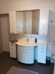 Ванная комната в Ferienwohnung Am Stadtfeldgraben