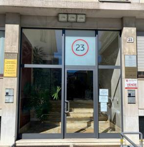 a glass door of a building with a sign on it at Casa Eugenia in Varese