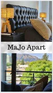 MaJo Apart في سان لويس: غرفة معيشة مع أريكة وطاولة مع مصباح