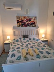 a bedroom with a bed with two pillows on it at Apartment Drazica in Opatija