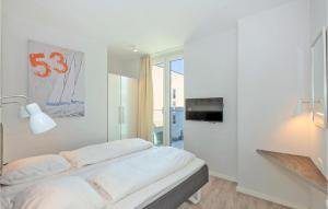 Ein Bett oder Betten in einem Zimmer der Unterkunft Passatvilla - Apartment 5