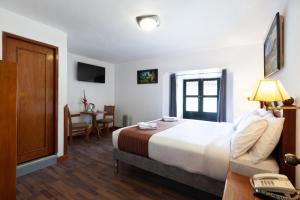 Postel nebo postele na pokoji v ubytování Hotel Amerinka + 29 fotografií