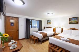 Letto o letti in una camera di Hotel Amerinka