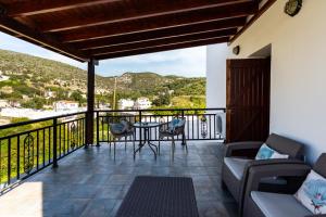 a patio with a table and chairs on a balcony at Steni Traditional Studio Apartment in Paphos