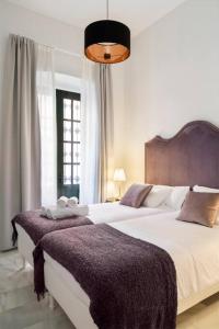 Postel nebo postele na pokoji v ubytování San Buenaventura Apartment 12