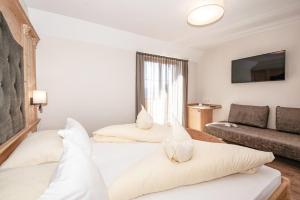 Postel nebo postele na pokoji v ubytování Hotel Pichler