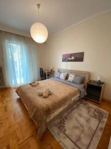 a bedroom with a large bed in a room at family house in Xanthi