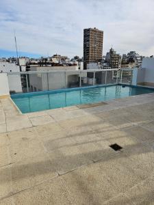 a swimming pool on the roof of a building at LaMari in Buenos Aires