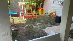 a backyard with a playground with a play equipment at Maison 9 km Disneyland 30 min Paris in Esbly