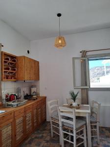 Kuchyň nebo kuchyňský kout v ubytování Poudas House