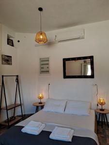 Postel nebo postele na pokoji v ubytování Poudas House