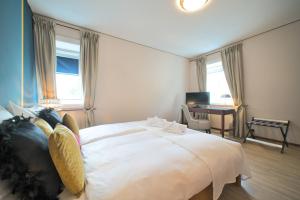 Postel nebo postele na pokoji v ubytování Tulip Inn Beaulieu Lausanne
