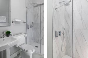 a bathroom with a shower and a toilet and a sink at San Buenaventura Apartment 13 in Seville