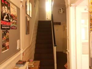 a staircase in a house with a stair case at Cromwell House in Eastbourne