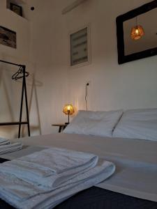 Postel nebo postele na pokoji v ubytování Poudas House