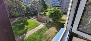 a view of a playground from a window at Apartments near the center and airport in Tallinn