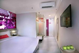 Postel nebo postele na pokoji v ubytování favehotel Cimanuk Garut