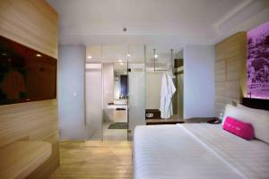 Postel nebo postele na pokoji v ubytování favehotel Cimanuk Garut