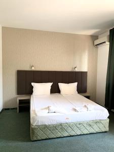Postel nebo postele na pokoji v ubytování Hotel Opal