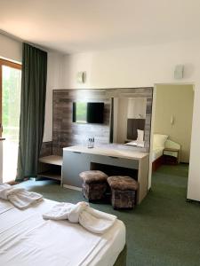 Postel nebo postele na pokoji v ubytování Hotel Opal
