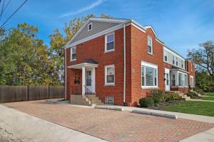 a red brick house on a brick driveway at Sunny & Spacious 3-Bedroom Apt - Carmen 5640 & 5641 rep in Chicago