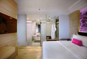 Postel nebo postele na pokoji v ubytování favehotel Cimanuk Garut
